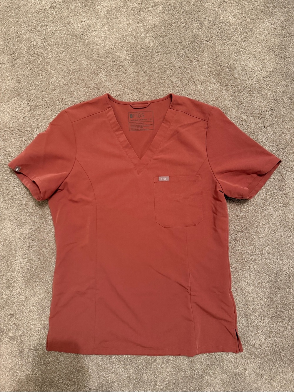 Women’s FIGS V-Neck Scrub Top. Color mauve.
